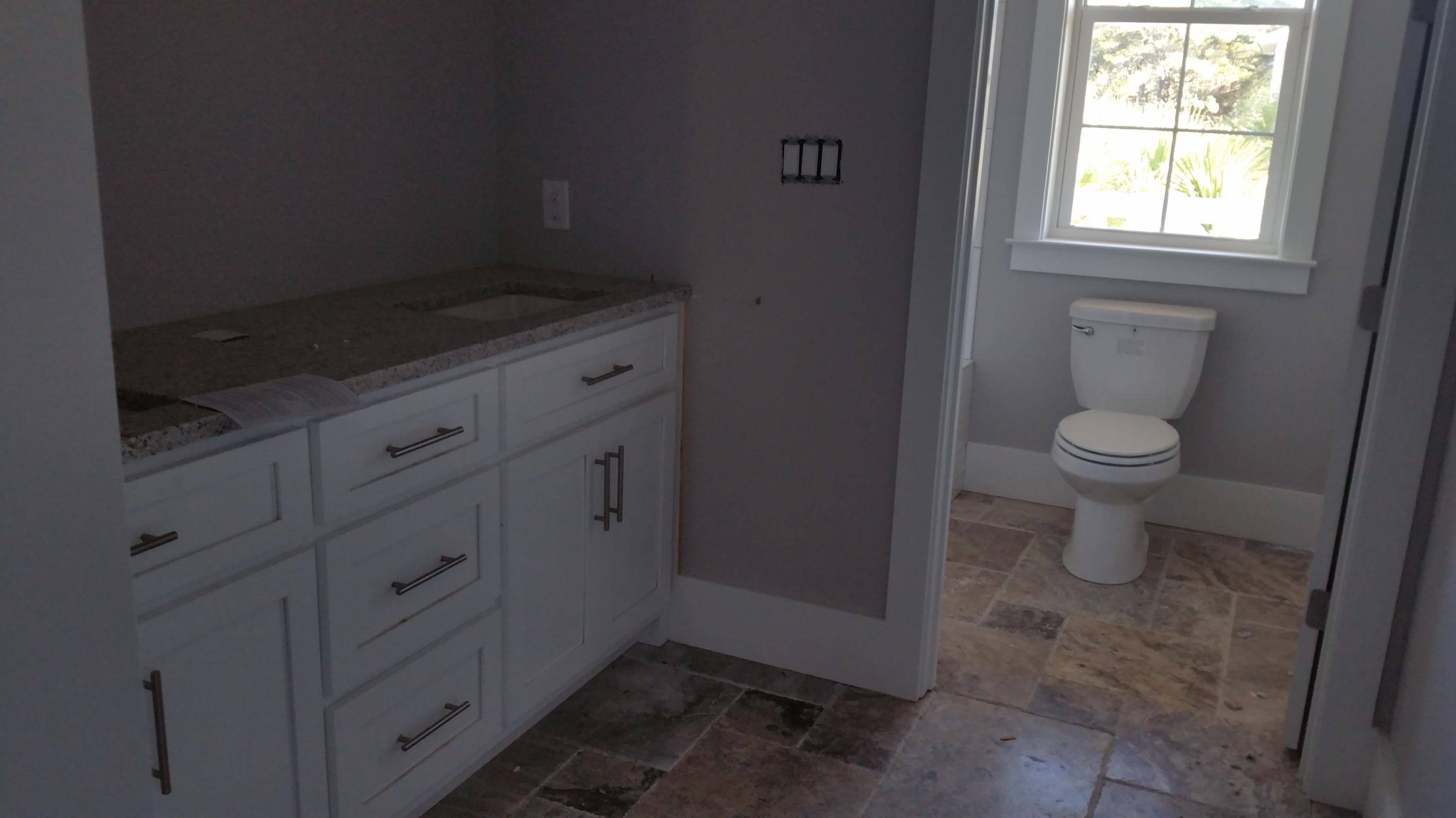 39 Lifeguard Loop Seacrest, FL 32461 - Photo 35 of 59 a bathroom with a granite countertop toilet and a sink