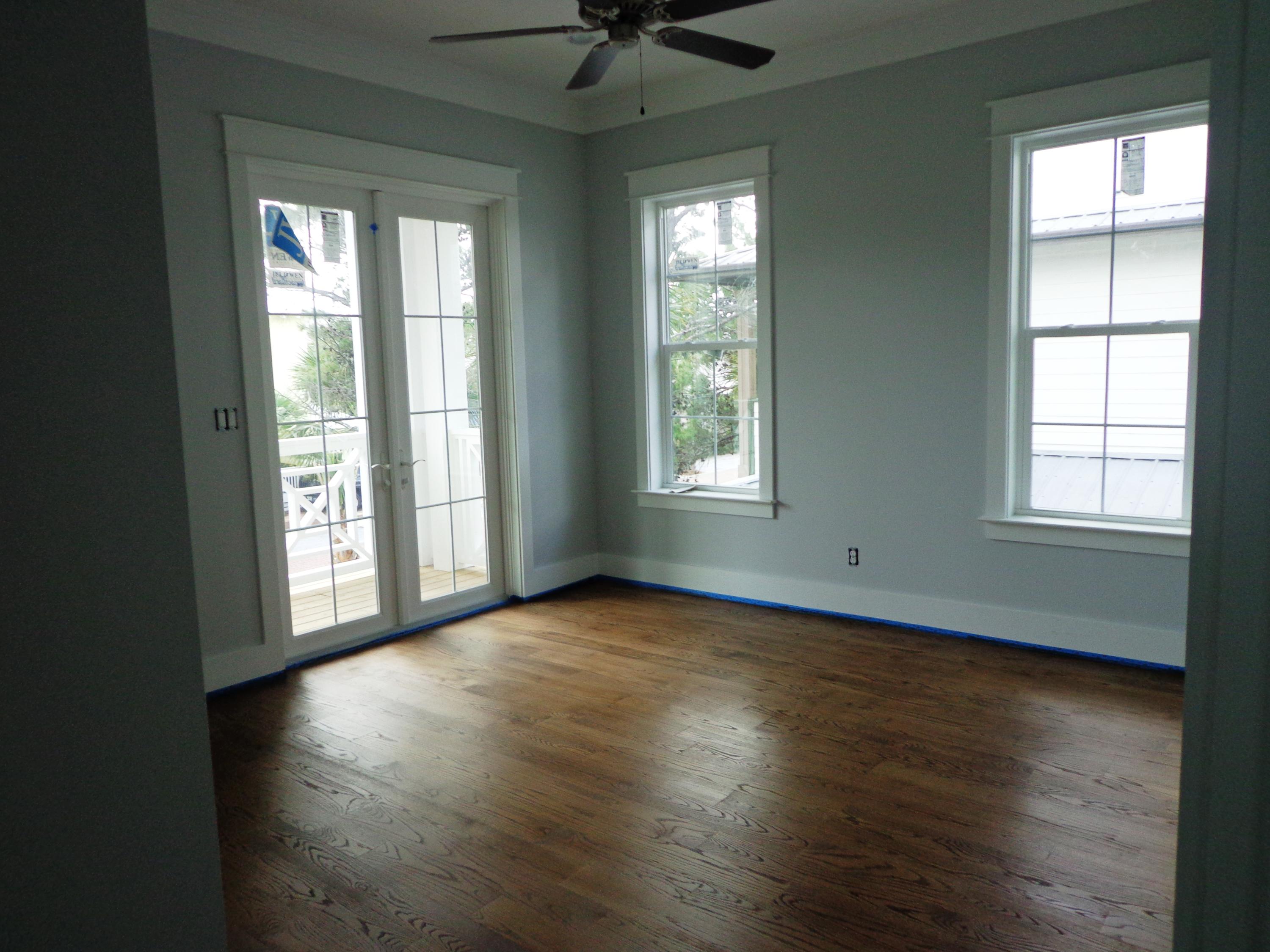 39 Lifeguard Loop Seacrest, FL 32461 - Photo 36 of 59 a view of an empty room with a window and wooden floor