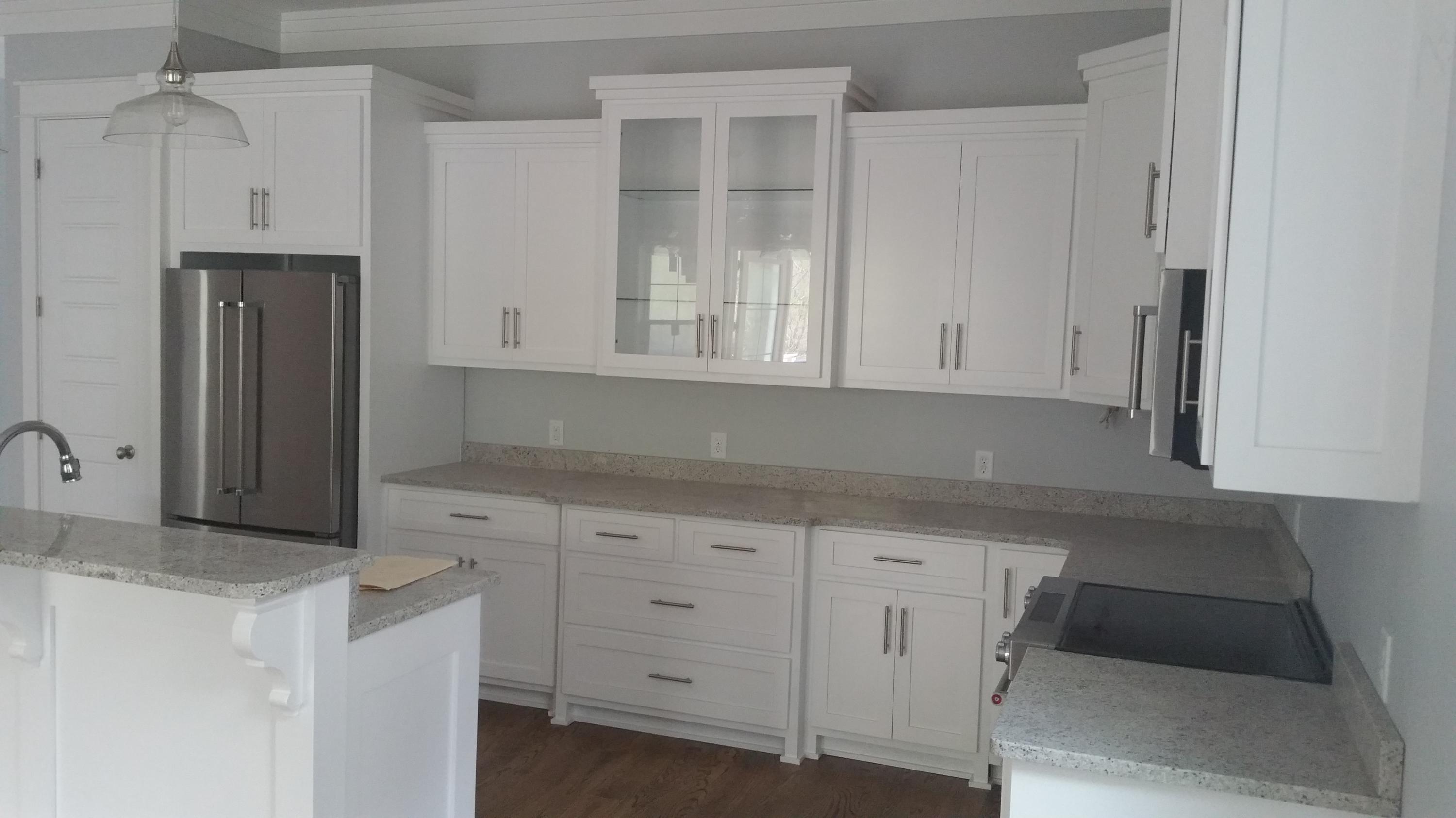 39 Lifeguard Loop Seacrest, FL 32461 - Photo 4 of 59 a kitchen with granite countertop white cabinets and stainless steel appliances