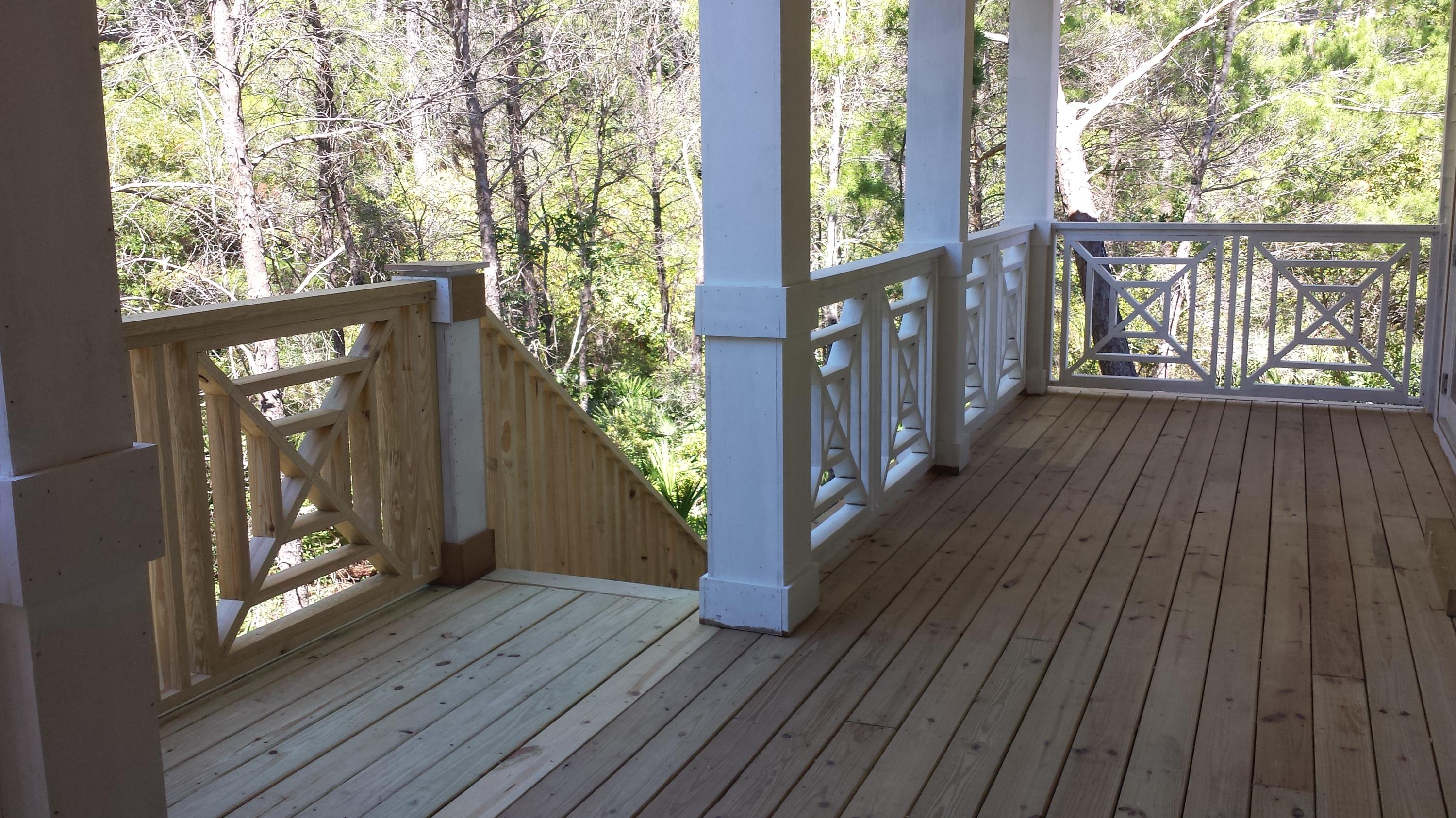 39 Lifeguard Loop Seacrest, FL 32461 - Photo 42 of 59 a view of a porch with wooden floor and gate