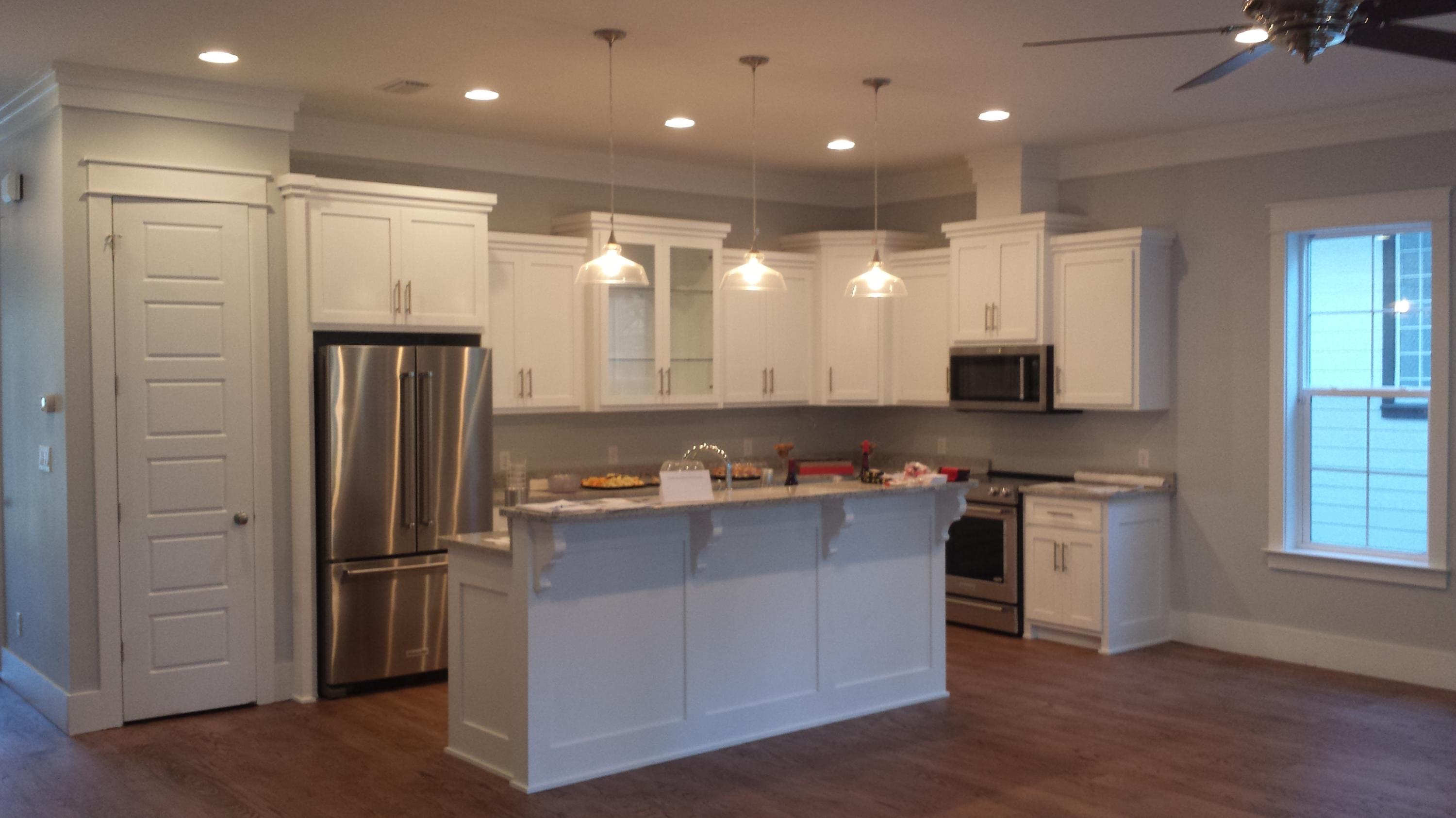 39 Lifeguard Loop Seacrest, FL 32461 - Photo 48 of 59 a kitchen with stainless steel appliances granite countertop a refrigerator a sink and a stove