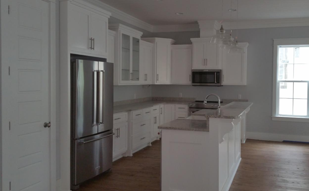 39 Lifeguard Loop Seacrest, FL 32461 - Photo 9 of 59 a kitchen with a refrigerator sink and cabinets