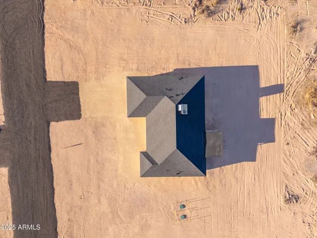 a view of an outdoor space and a front view of a house