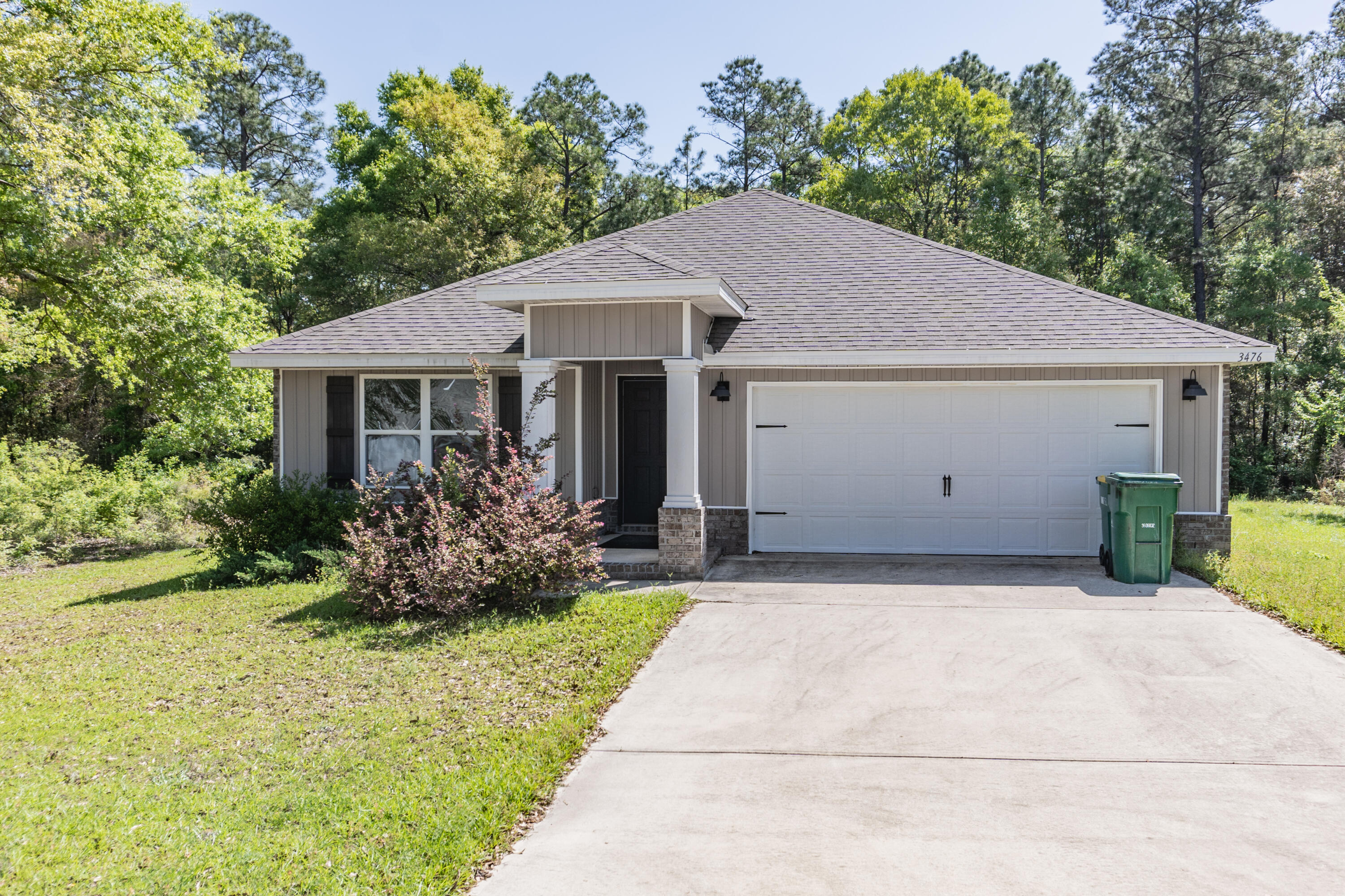 a house with trees in the background