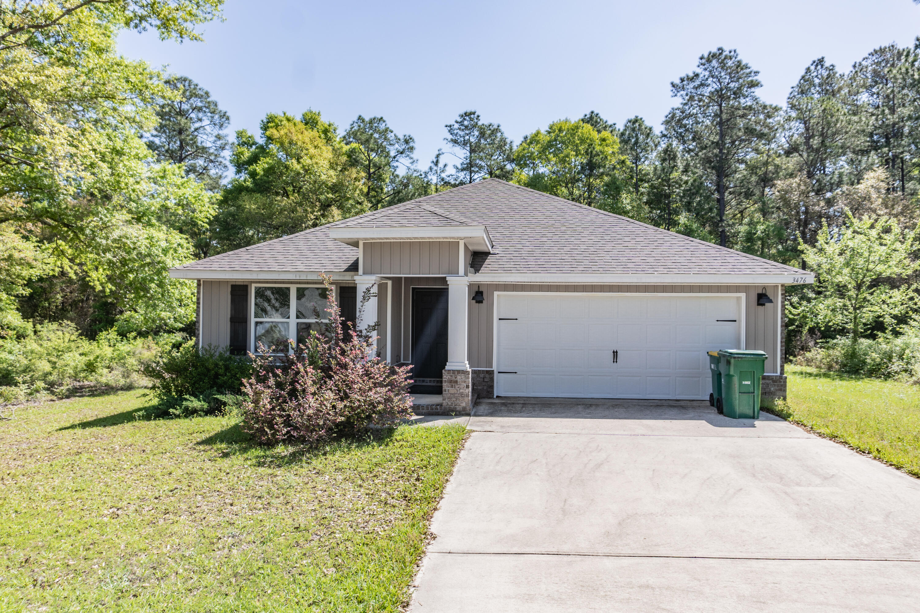 3476 Sparco Drive Crestview, FL 32539 - Photo 16 of 24 a front view of house with yard and green space