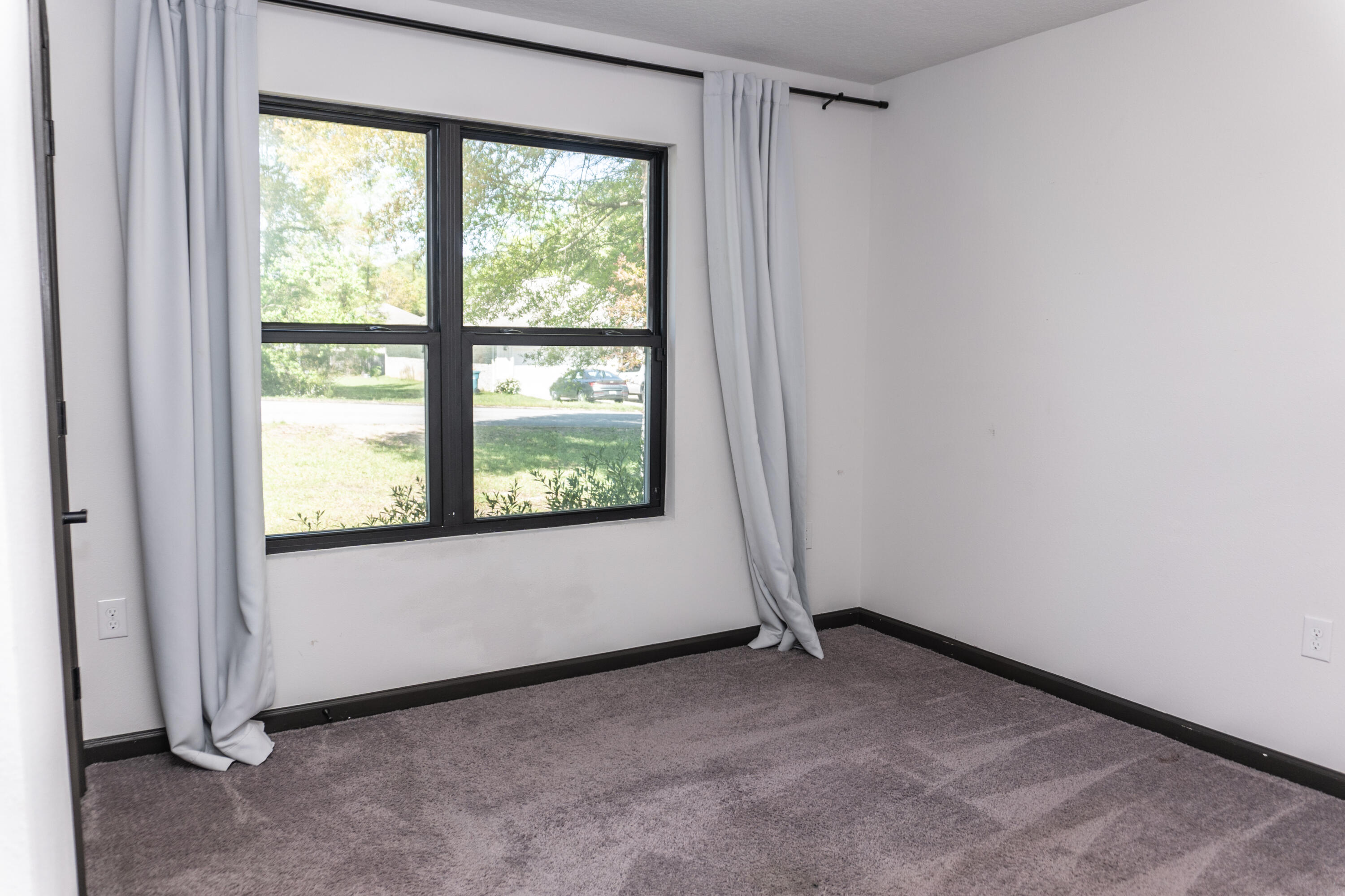 3476 Sparco Drive Crestview, FL 32539 - Photo 17 of 24 a view of an empty room with a window