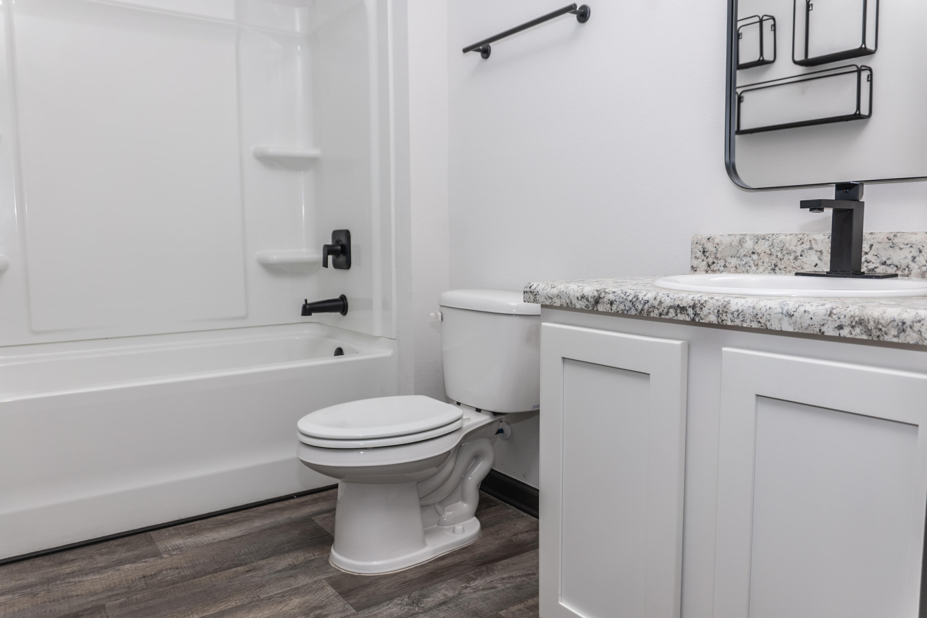3476 Sparco Drive Crestview, FL 32539 - Photo 18 of 24 a bathroom with a granite countertop toilet sink and mirror