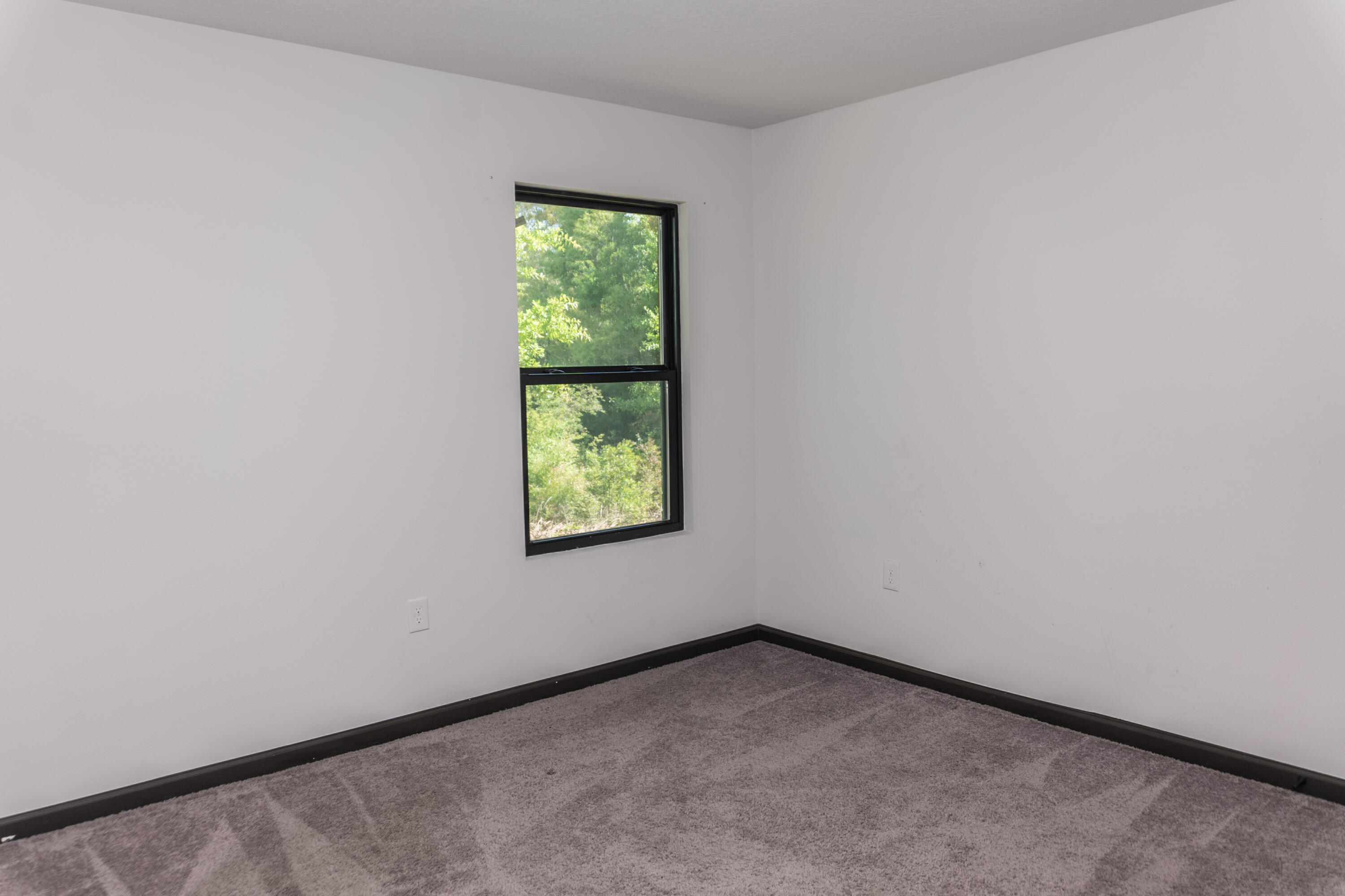 3476 Sparco Drive Crestview, FL 32539 - Photo 19 of 24 a view of an empty room and a window