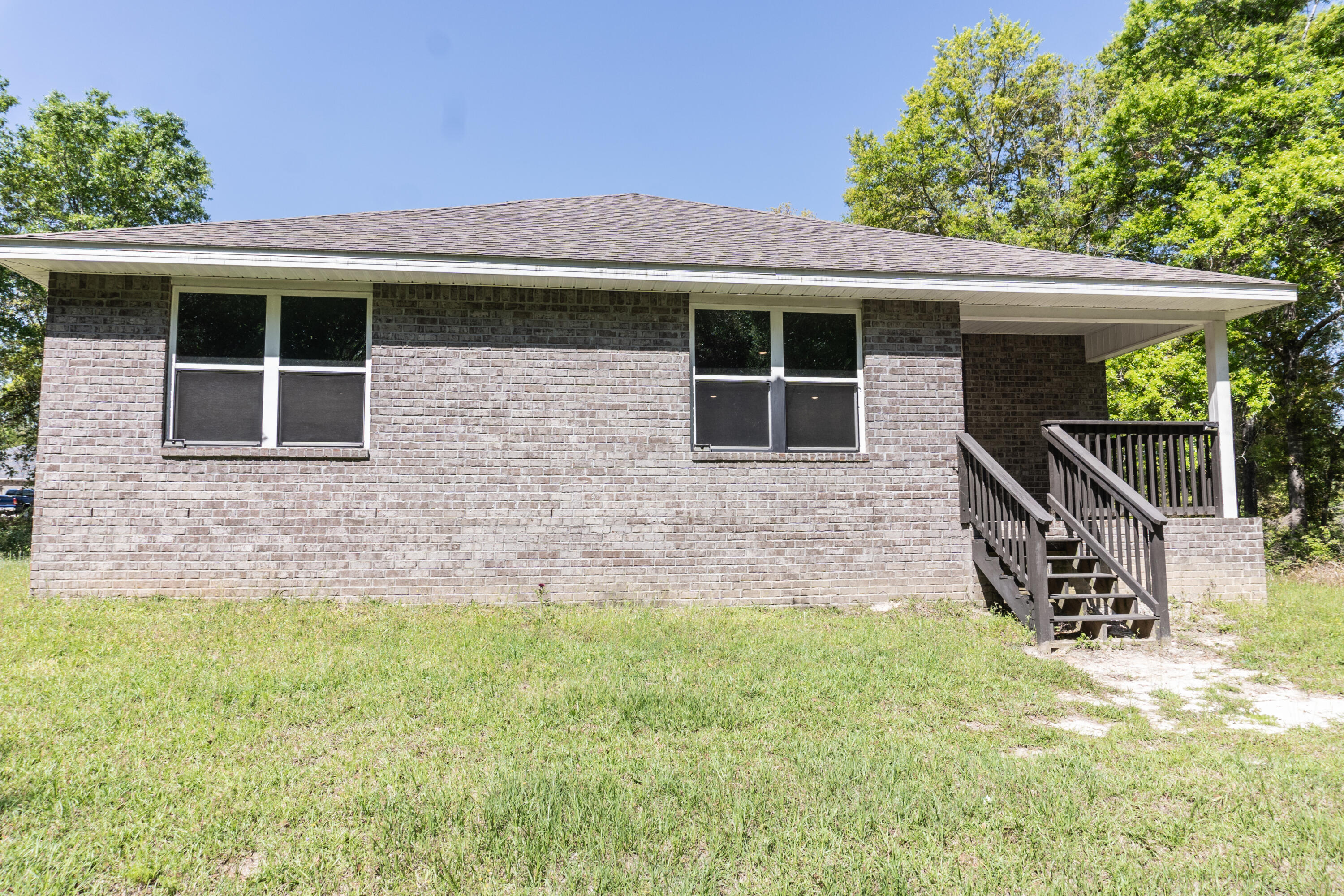 3476 Sparco Drive Crestview, FL 32539 - Photo 22 of 24 a front view of a house with yard