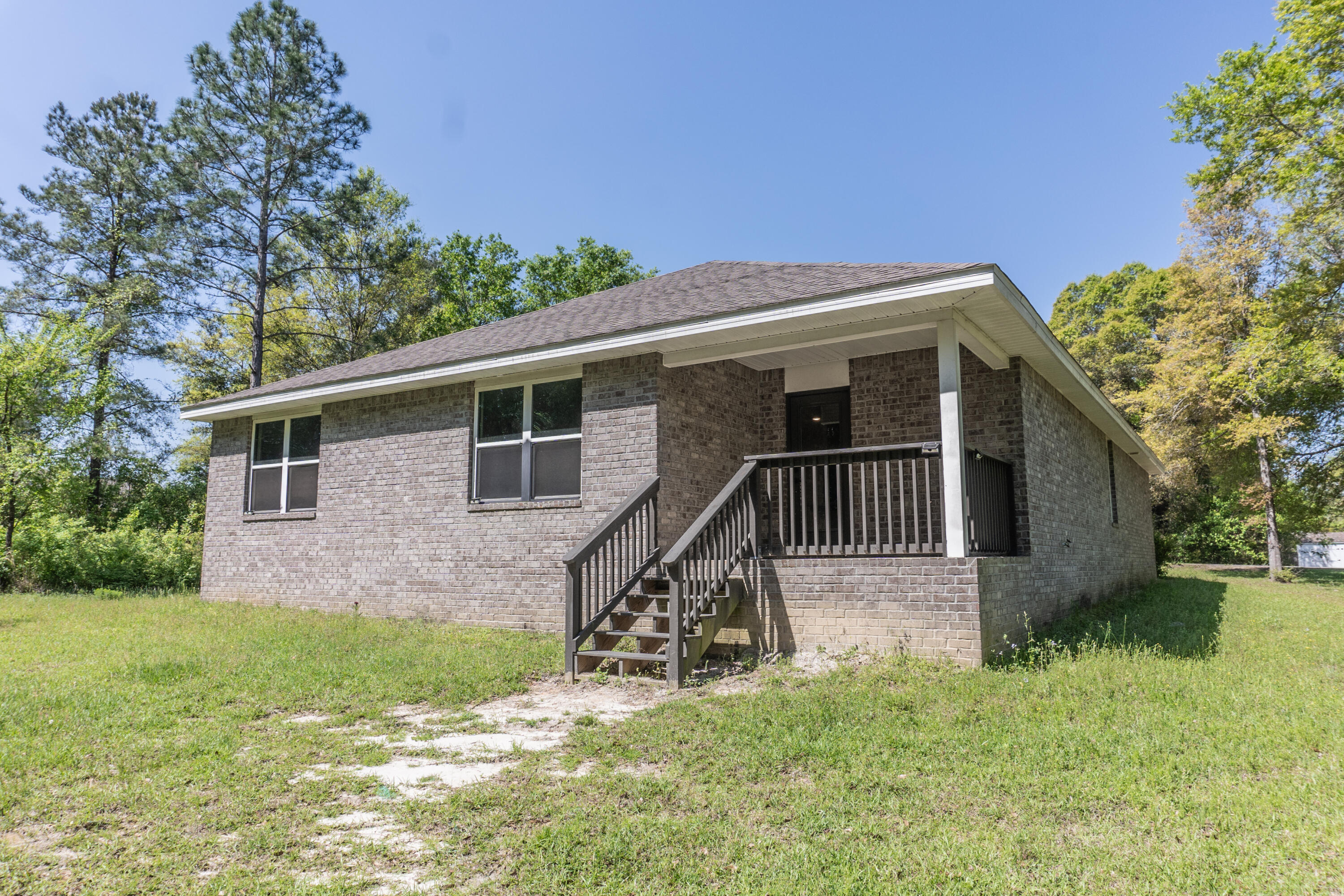 3476 Sparco Drive Crestview, FL 32539 - Photo 24 of 24 a view of a house with a yard