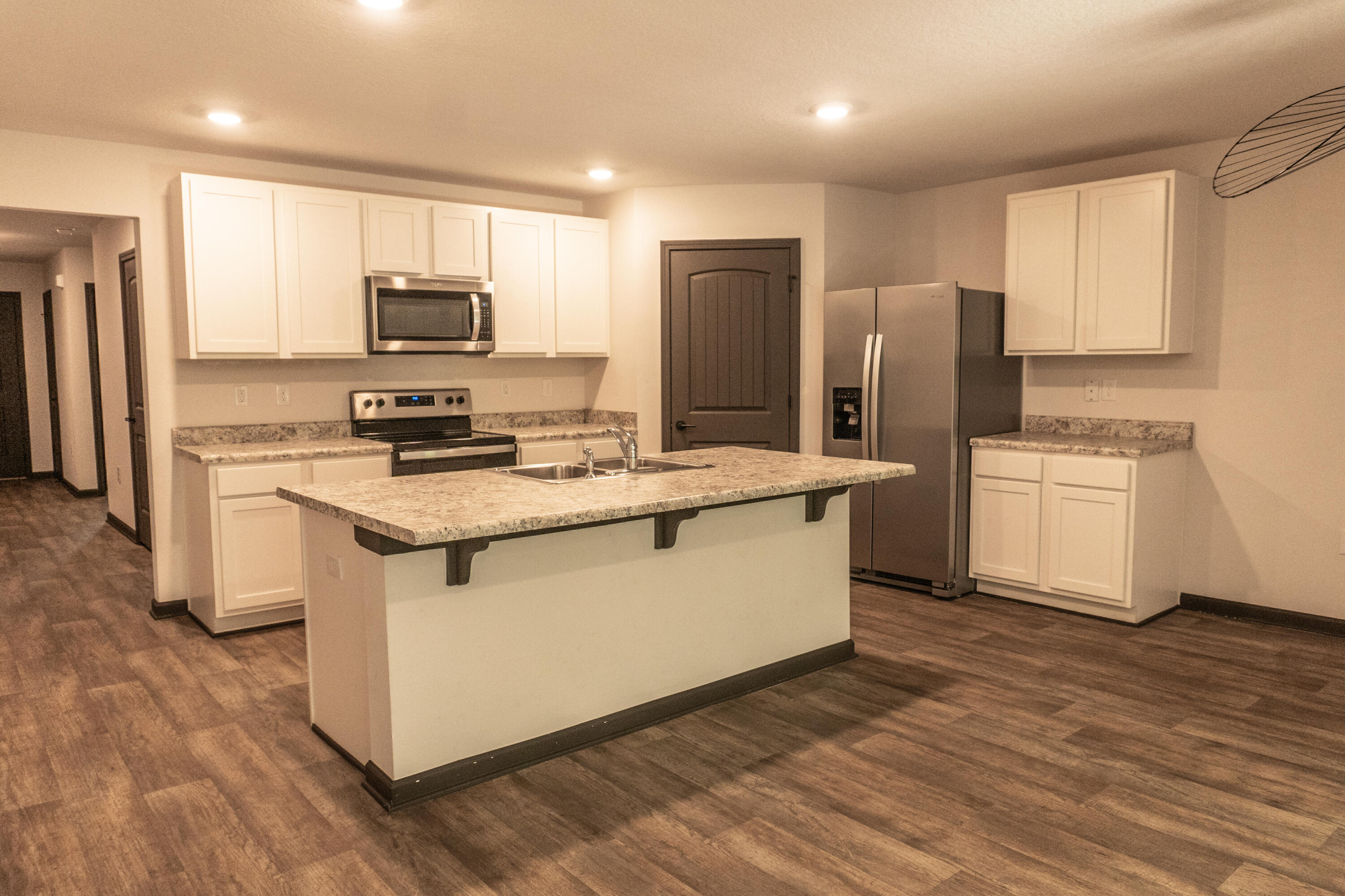 3476 Sparco Drive Crestview, FL 32539 - Photo 3 of 24 a kitchen with stainless steel appliances a refrigerator stove microwave and sink