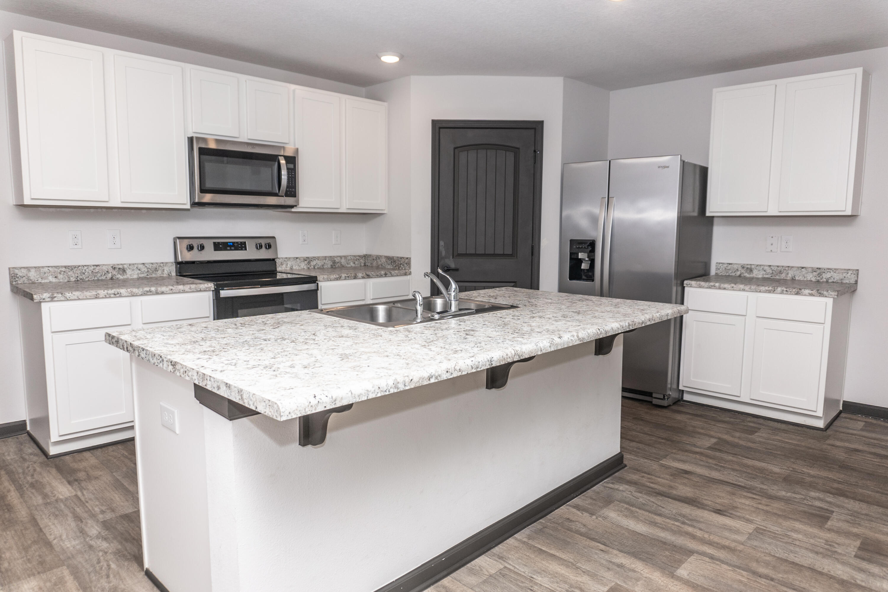 3476 Sparco Drive Crestview, FL 32539 - Photo 6 of 24 a kitchen with stainless steel appliances granite countertop a sink stove and refrigerator
