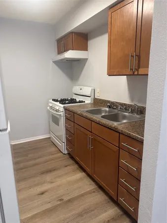 a kitchen with a stove and a sink