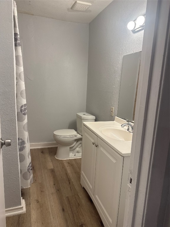 9100 Dodson Street, Unit 16 Houston, TX 77093 - Photo 7 of 14 a view of bathroom with a toilet sink and a mirror