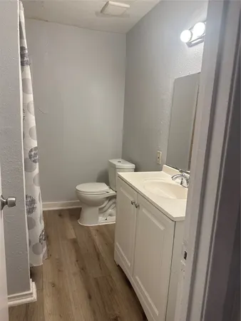 a view of bathroom with a toilet sink and a mirror