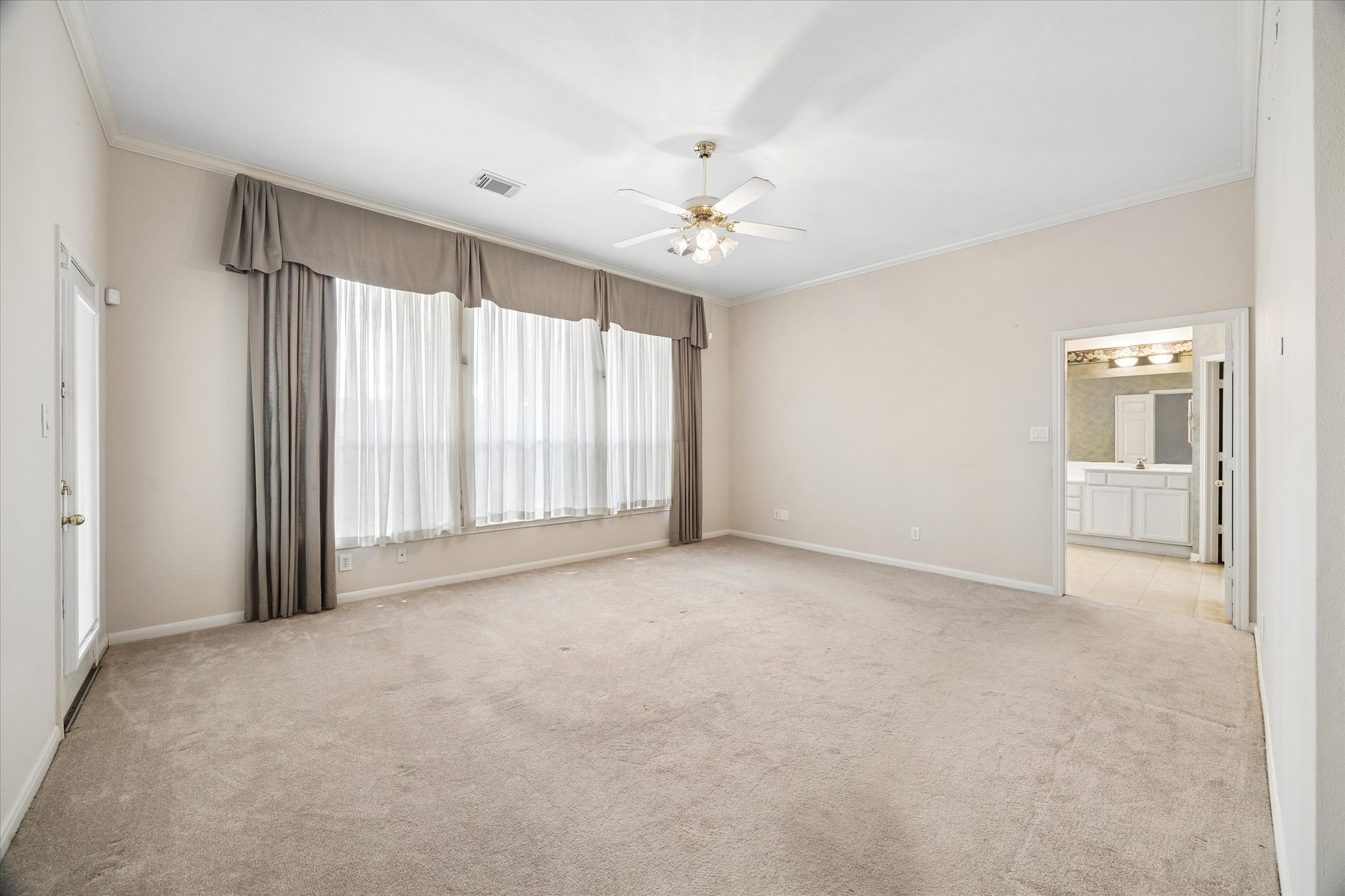 1203 Bingle Road Houston, TX 77055 - Photo 11 of 21 A view of the spacious primary bedroom and ensuite bathroom.
