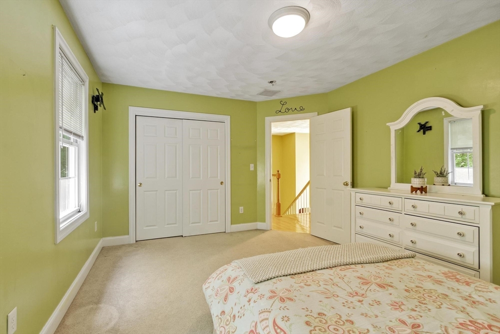 4 Forest Street Georgetown, MA 01833 - Photo 31 of 37 a bedroom with a bed and a dresser