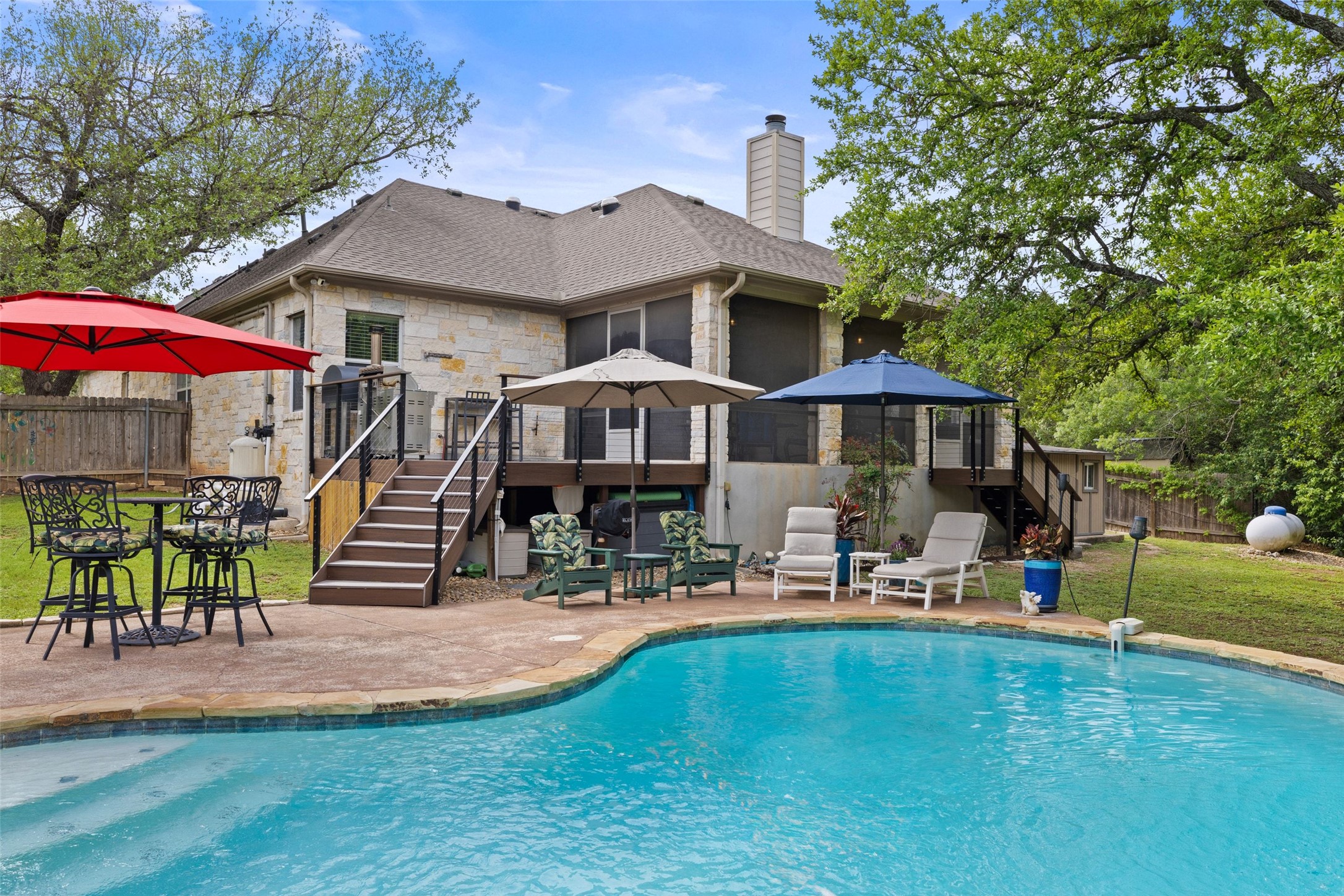 15208 Nightingale Lane Austin, TX 78734 - Photo 32 of 40 View of pool featuring patio surround, outdoor dining space, and a wooden deck