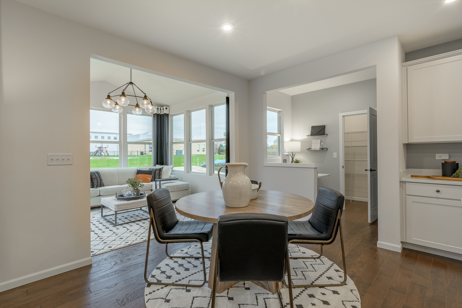 591 North Highlander Way Addison, IL 60101 - Photo 11 of 25 a view of a dining room with furniture window and wooden floor