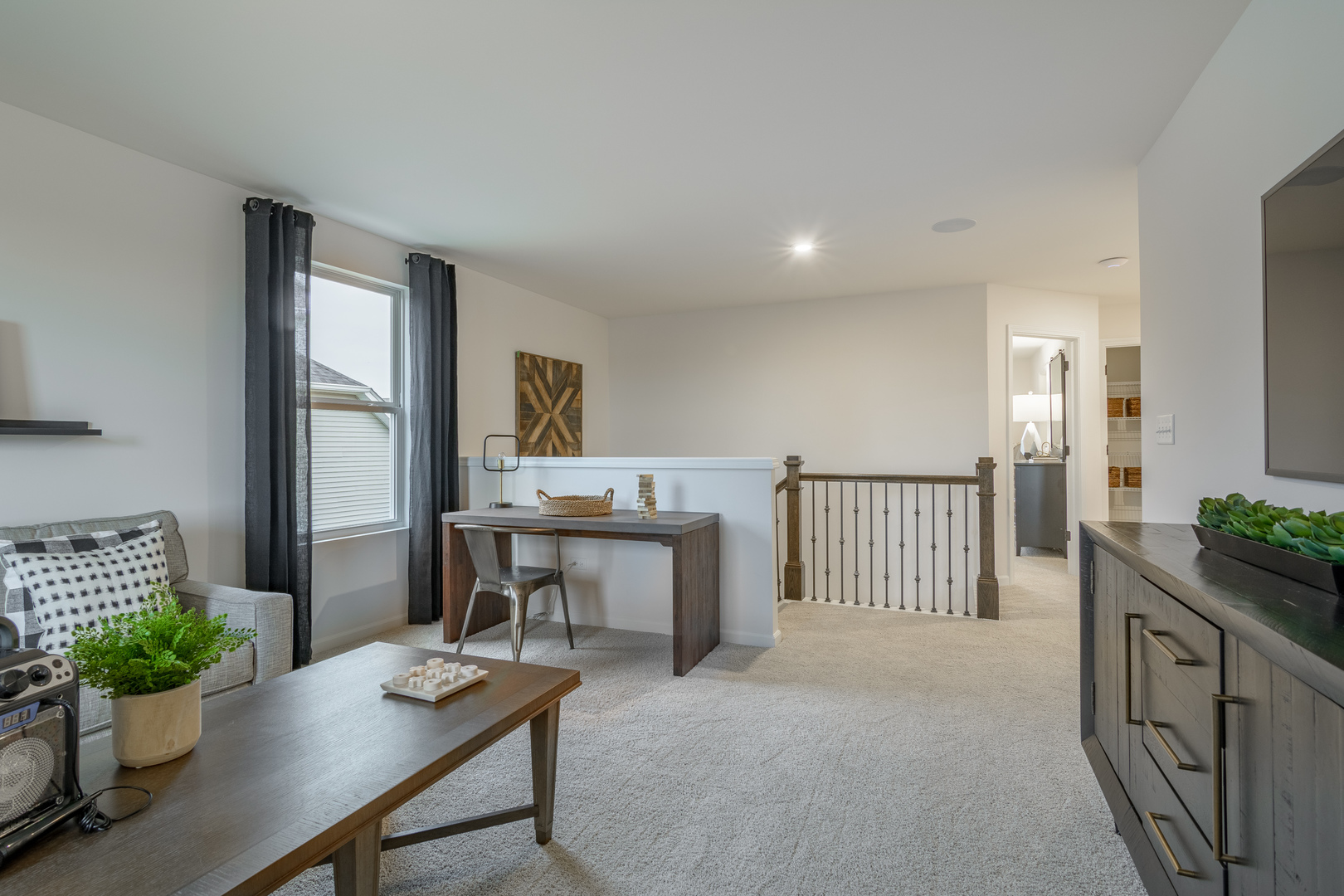 591 North Highlander Way Addison, IL 60101 - Photo 16 of 25 a view of a workspace with furniture and a potted plant