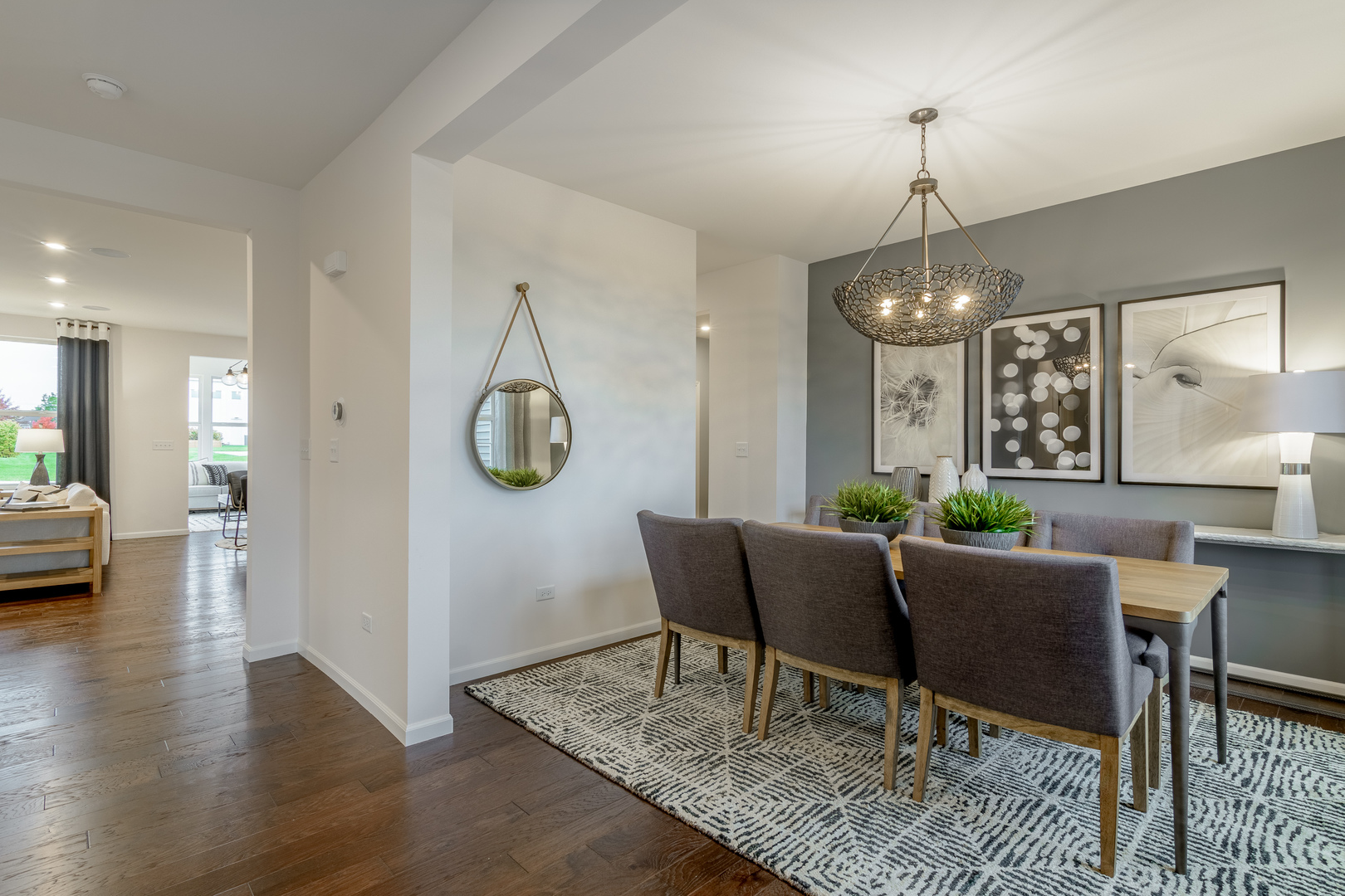 591 North Highlander Way Addison, IL 60101 - Photo 3 of 25 a living room with furniture and a chandelier