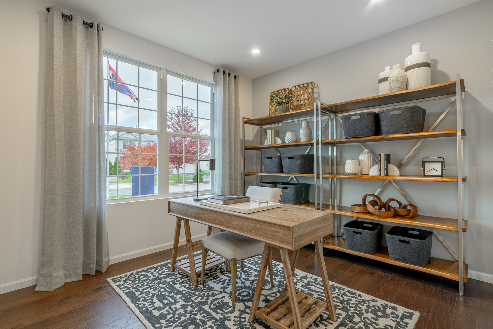 591 North Highlander Way Addison, IL 60101 - Photo 4 of 25 a view of a workspace with furniture and a window