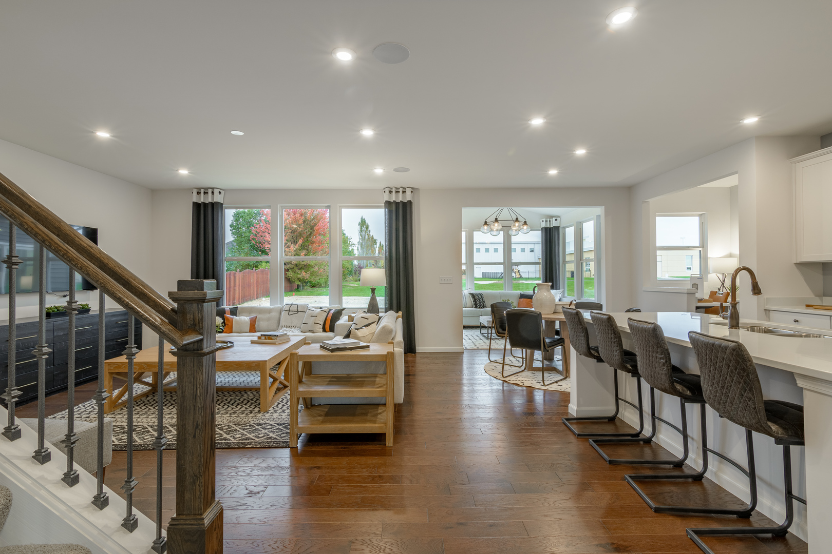 591 North Highlander Way Addison, IL 60101 - Photo 5 of 25 a living room with lots of furniture and a large window
