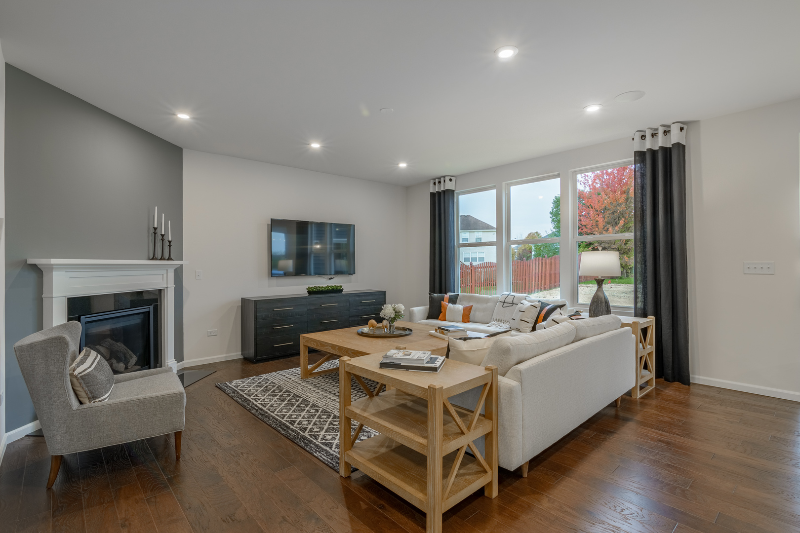591 North Highlander Way Addison, IL 60101 - Photo 9 of 25 a living room with furniture fireplace and a large window