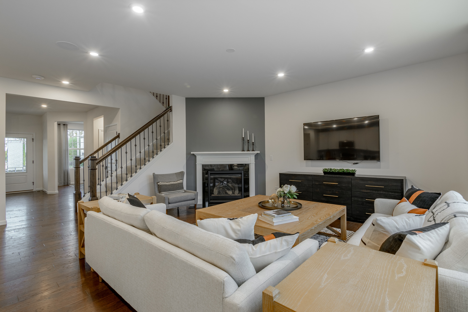 591 North Highlander Way Addison, IL 60101 - Photo 10 of 25 a living room with furniture and a flat screen tv