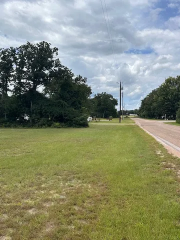 a view of a lake with a big yard