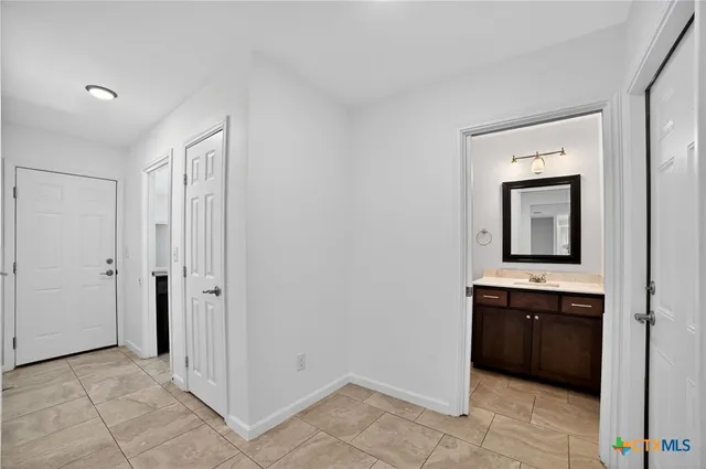 a view of a bathroom from the hallway