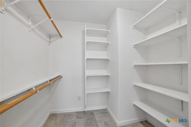 a view of an empty walk in closet