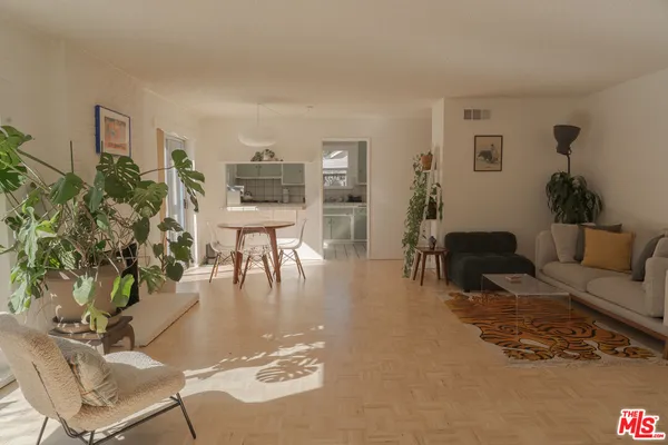 a living room with furniture and a table