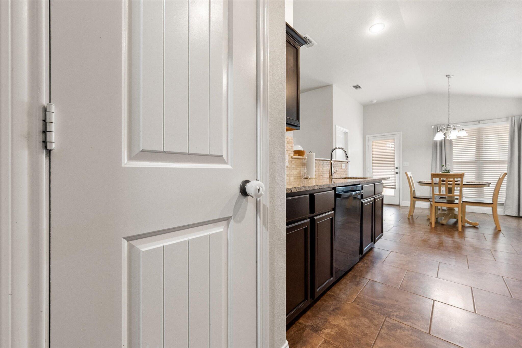 7026 97th Street Lubbock, TX 79424 - Photo 16 of 30 a kitchen with stainless steel appliances a sink and counter space