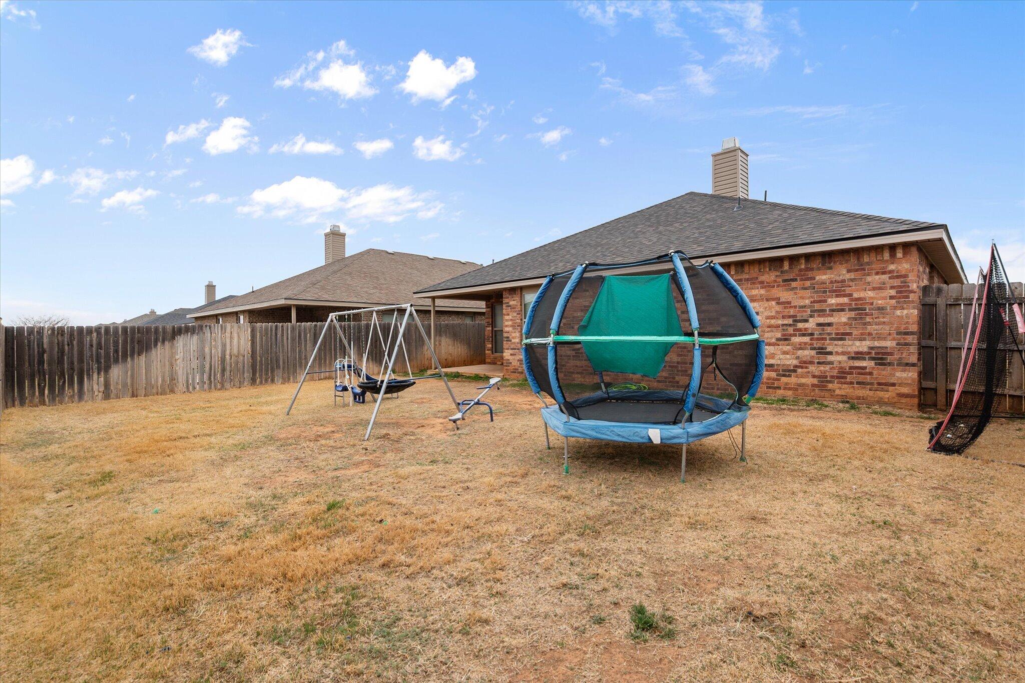 7026 97th Street Lubbock, TX 79424 - Photo 30 of 30 a view of a backyard