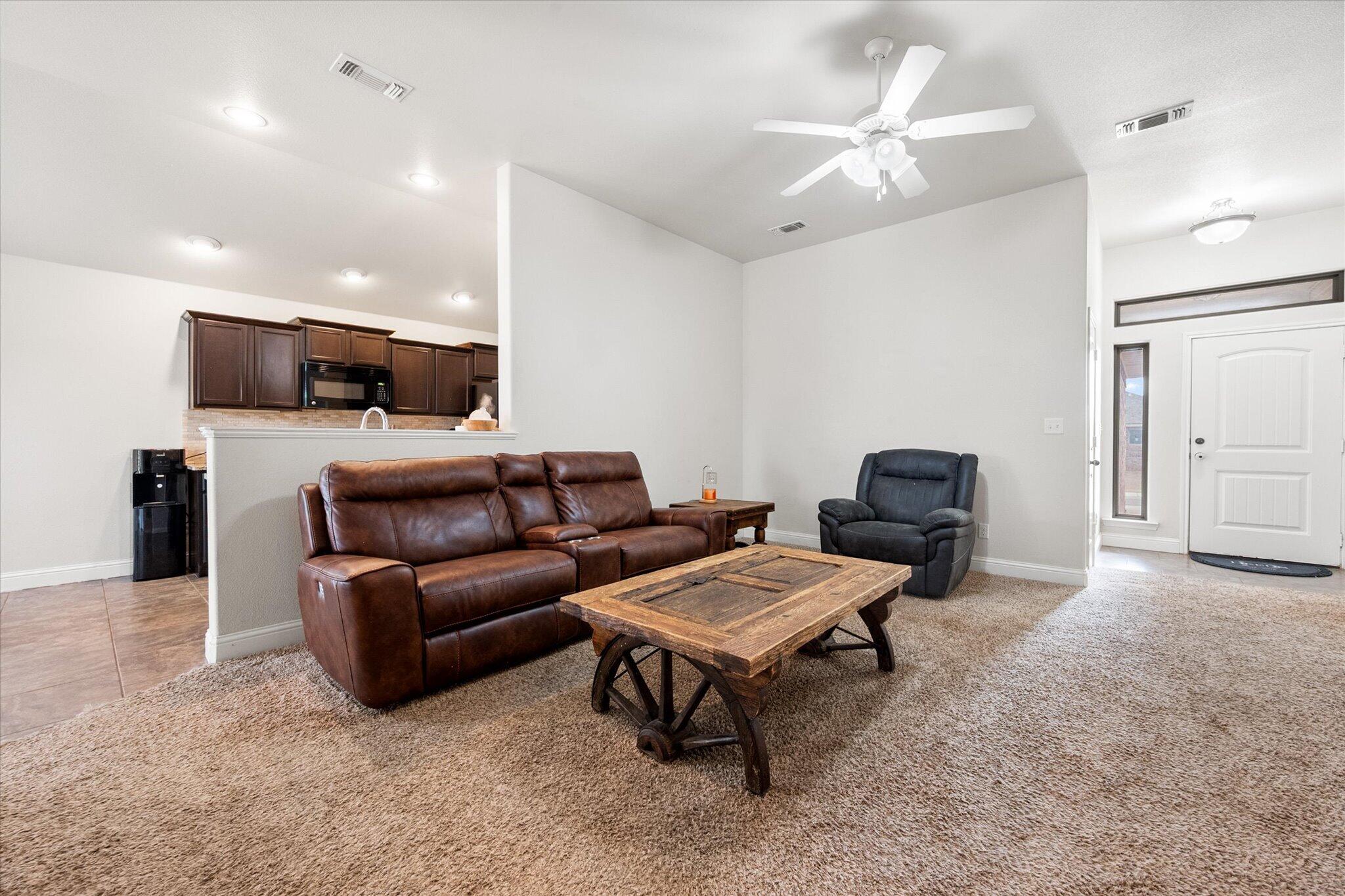 7026 97th Street Lubbock, TX 79424 - Photo 8 of 30 a living room with furniture and a view of kitchen