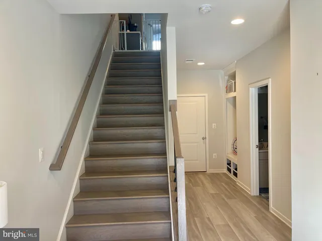 a view of an entryway with wooden floor