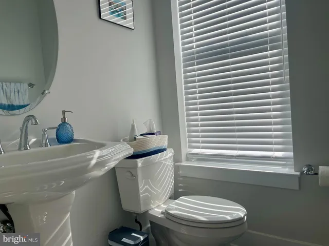 a bathroom with a toilet and a sink