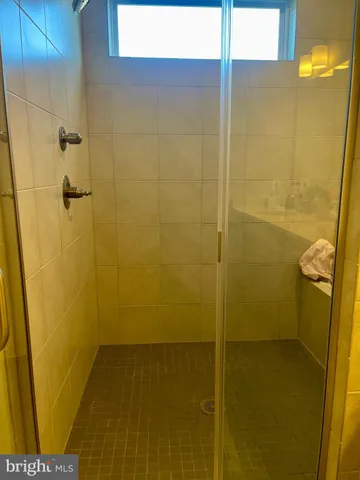 a white toilet sitting next to a sink