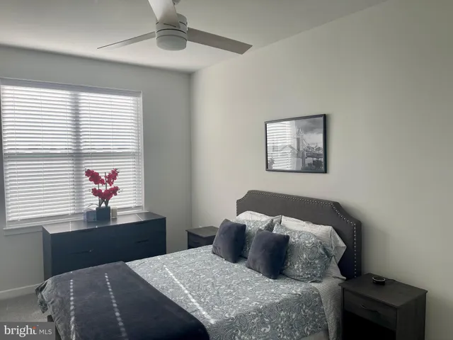 a bedroom with a bed and walk in closet