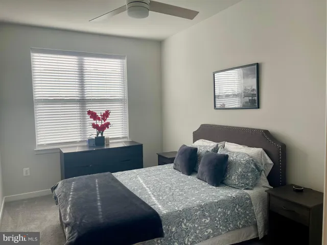 a bedroom with furniture and a window