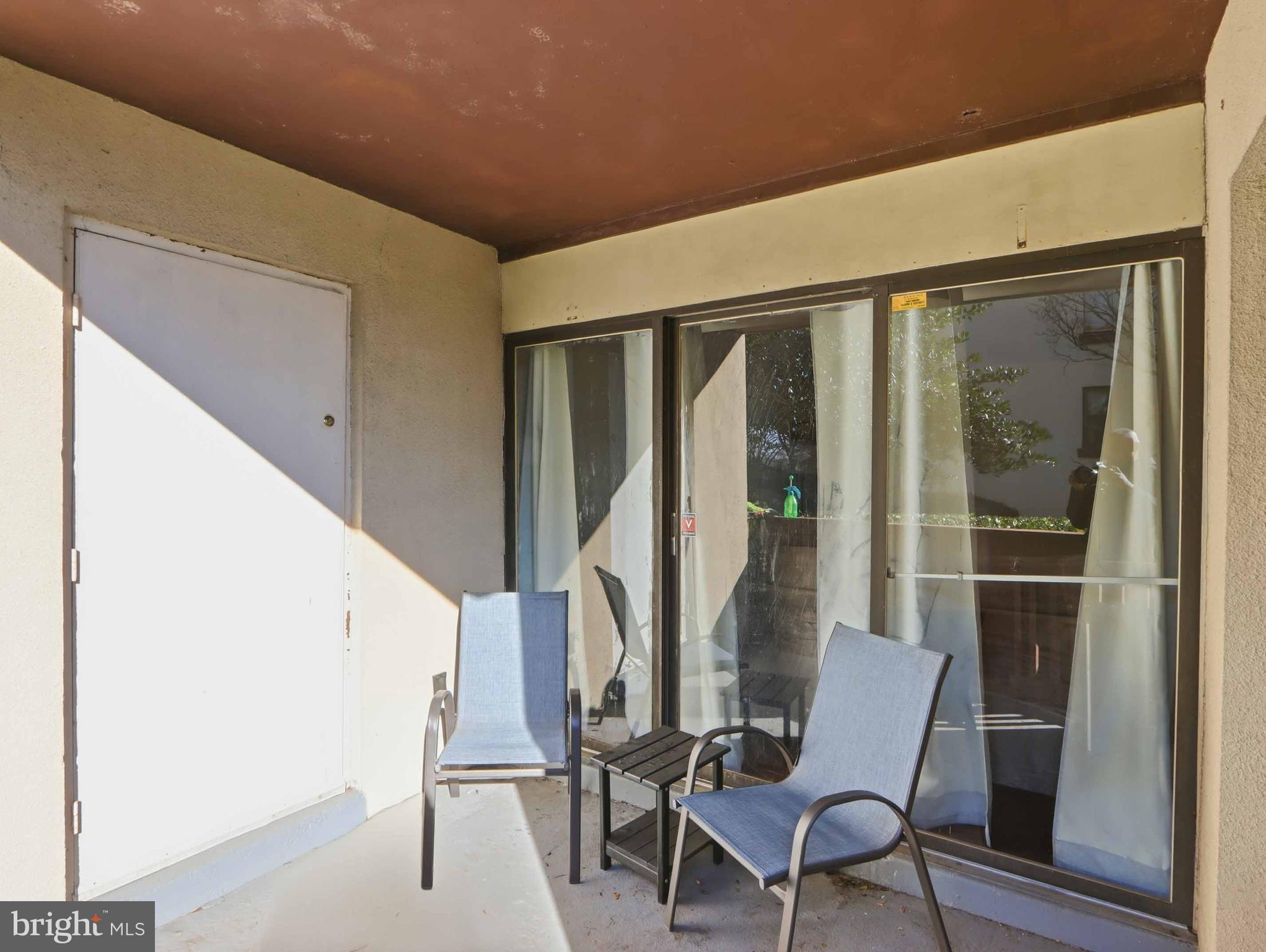 9641 White Acre Road, Unit A1 Columbia, MD 21045 - Photo 21 of 25 Private patio entrance off kitchen and living room