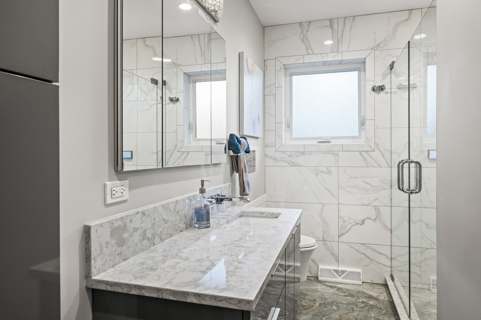 906 South Tower Lane Mount Prospect, IL 60056 - Photo 12 of 24 a bathroom with a granite countertop sink and a mirror
