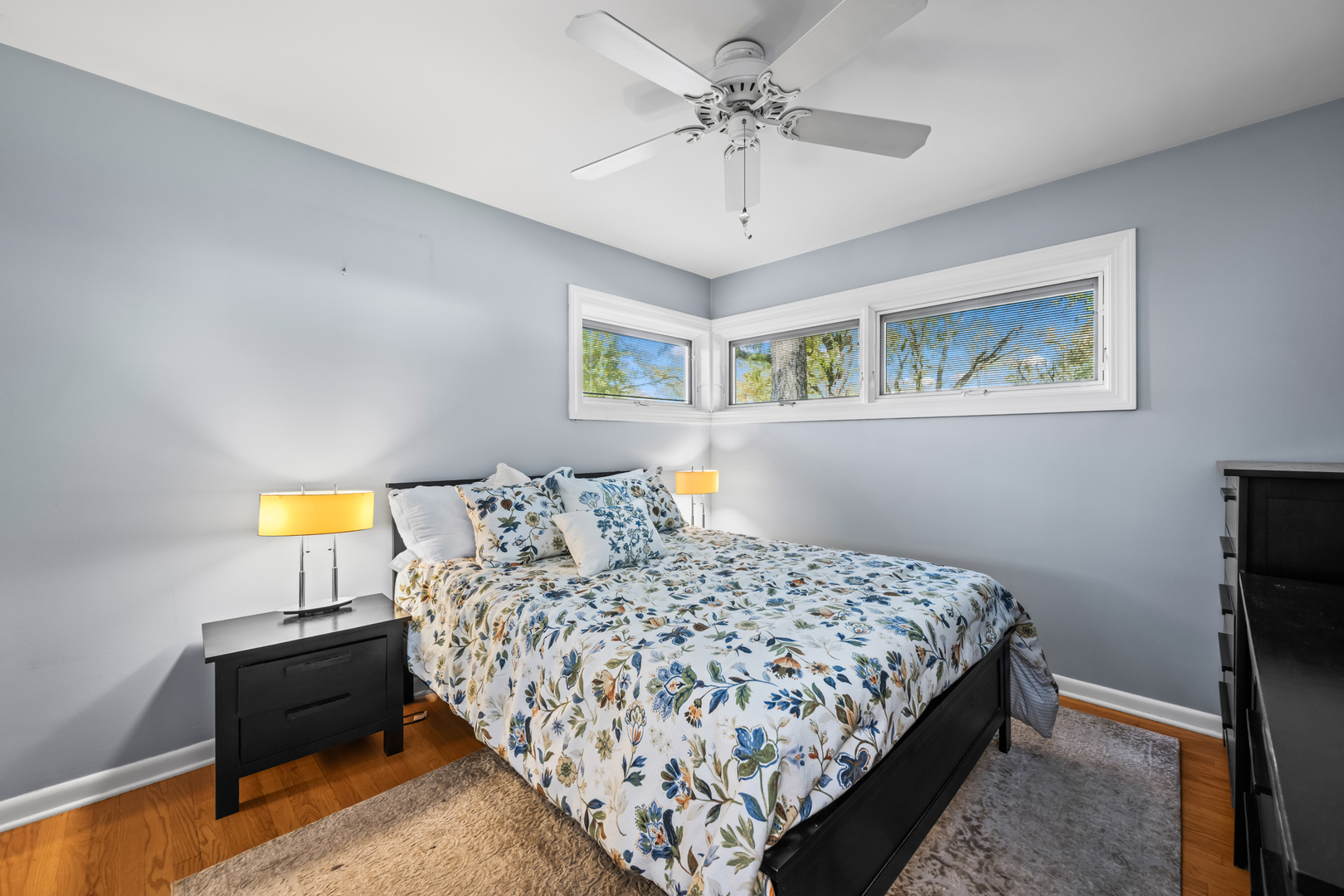 906 South Tower Lane Mount Prospect, IL 60056 - Photo 15 of 24 a bedroom with a bed and a chandelier