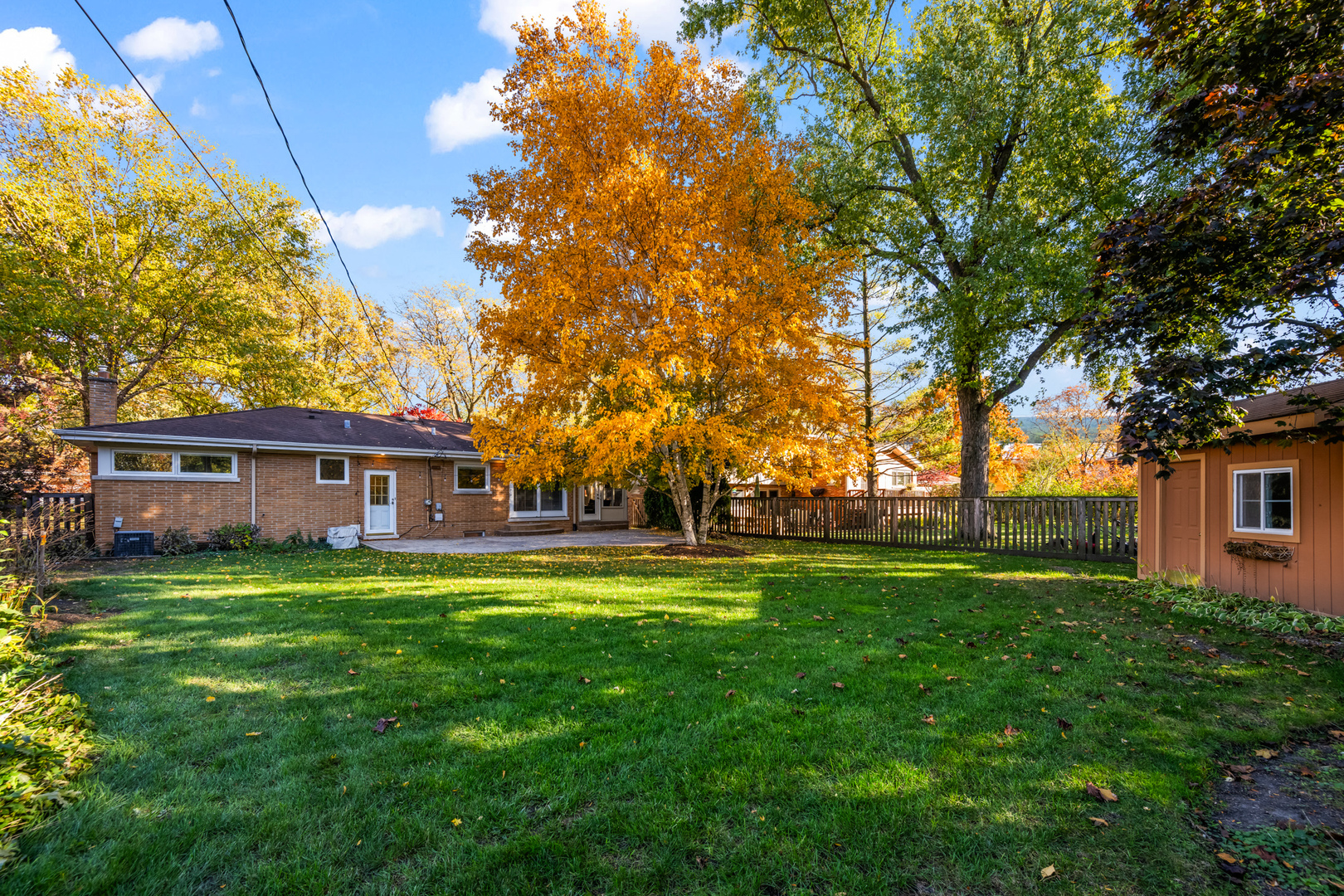 906 South Tower Lane Mount Prospect, IL 60056 - Photo 21 of 24 a backyard of a house with table and chairs