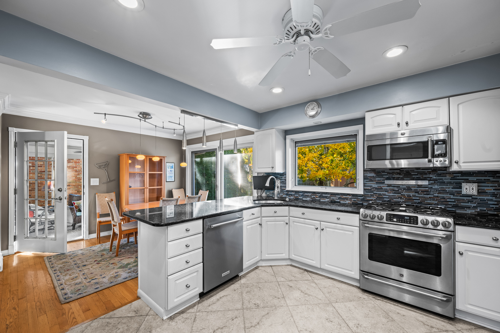 906 South Tower Lane Mount Prospect, IL 60056 - Photo 7 of 24 a kitchen with a stove a sink and a refrigerator