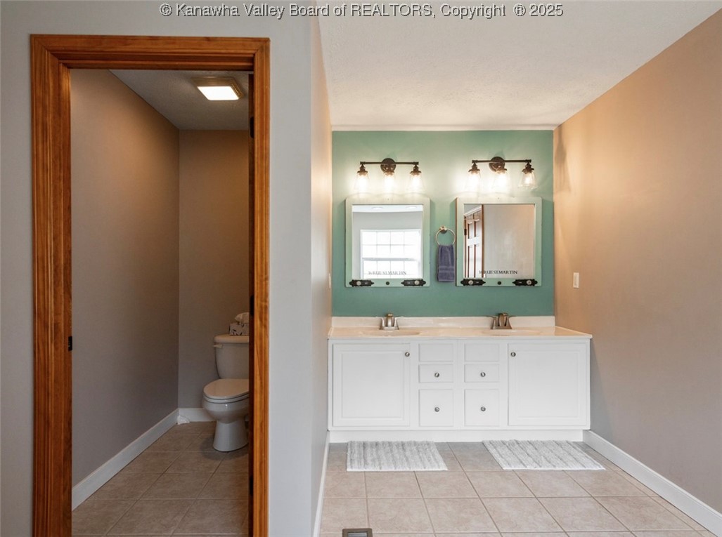 123 Baker Drive Winfield, WV 25213 - Photo 12 of 25 Main floor primary ensuite-dual sinks & watercloset