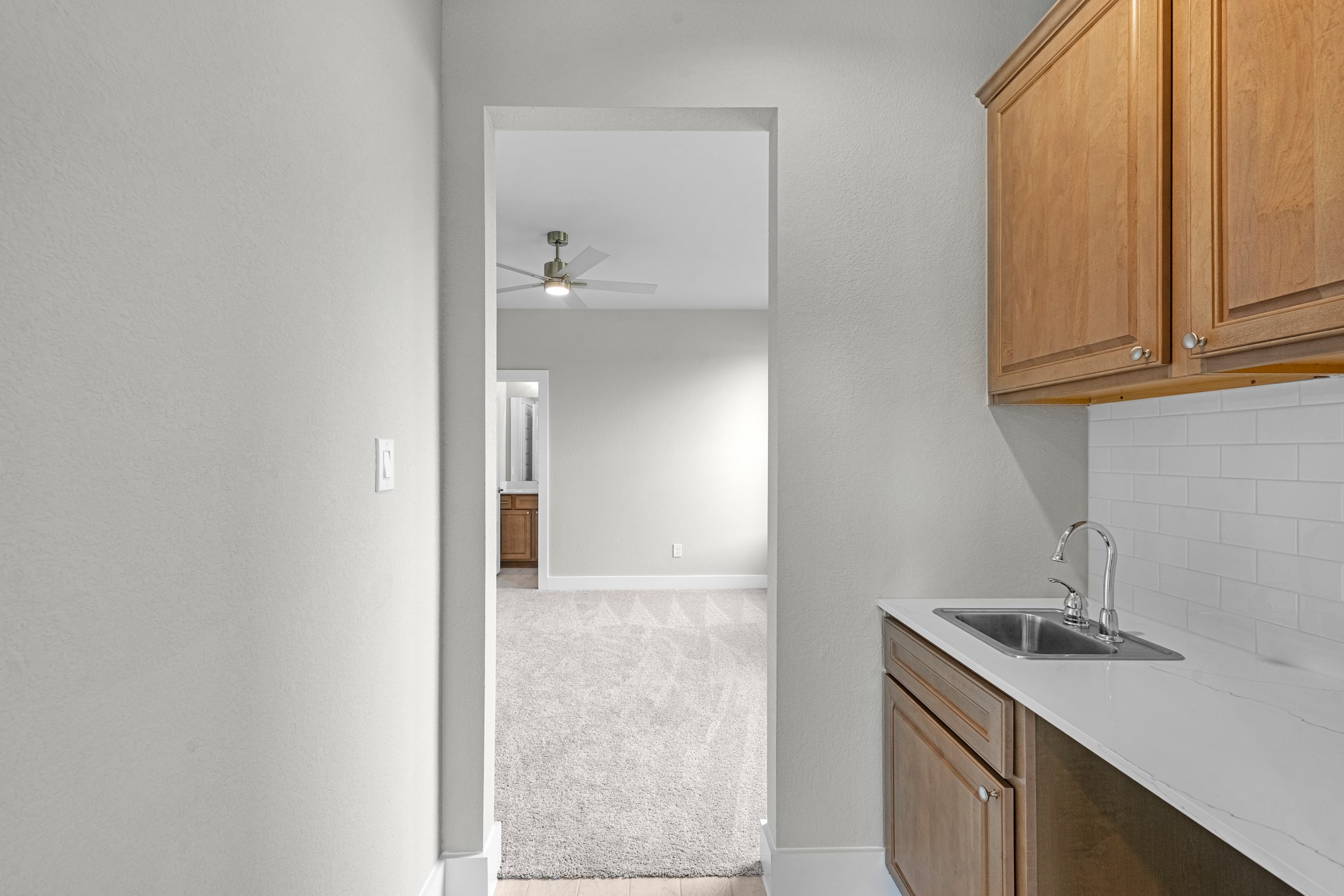 3410 Everglade Lane Rosenberg, TX 77471 - Photo 6 of 39 a kitchen with a sink and cabinets