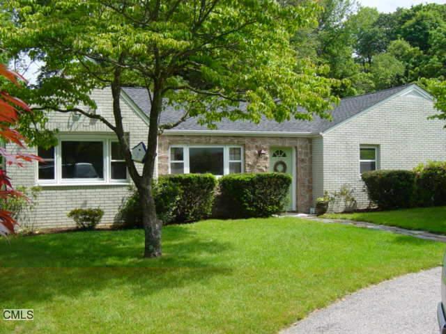 48 Bassick Road Trumbull, CT 06611 - Photo 1 of 1 a front view of a house with a yard