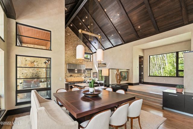 a view of a dining room with furniture window and outside view